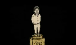 a man standing on a golden pedestal