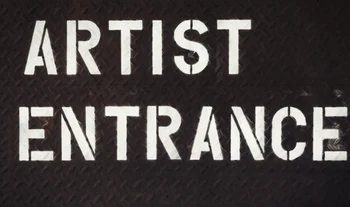 A sign that says artist entrance