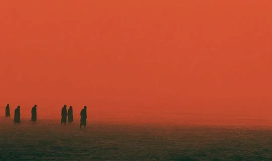 some people going into a red sea 