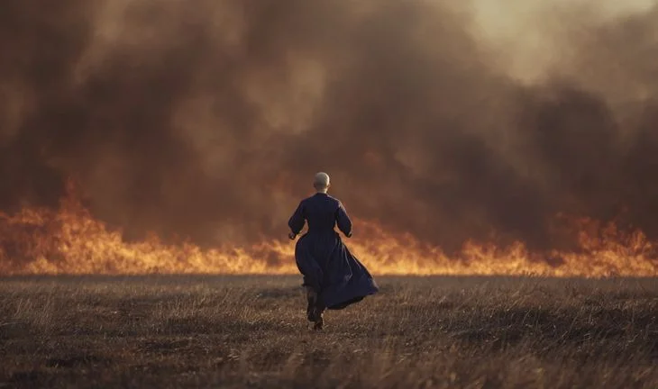bald woman brush fire