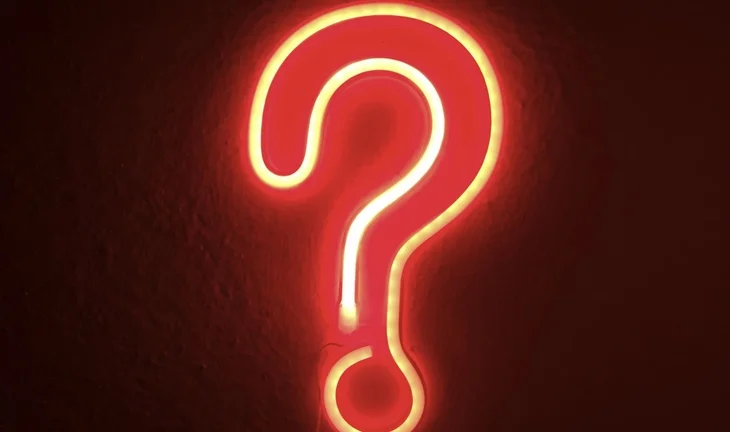 A question mark made from illuminated red lights 