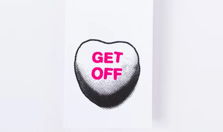 A drawing of a love heart sweet saying "Get off"
