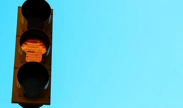 A traffic light showing amber