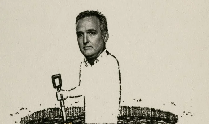 Diego Megia holding a spade in a hole