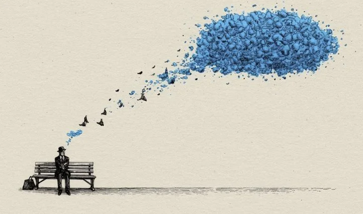 A man on a bench in a hat thinking of a strange blue thought bubble