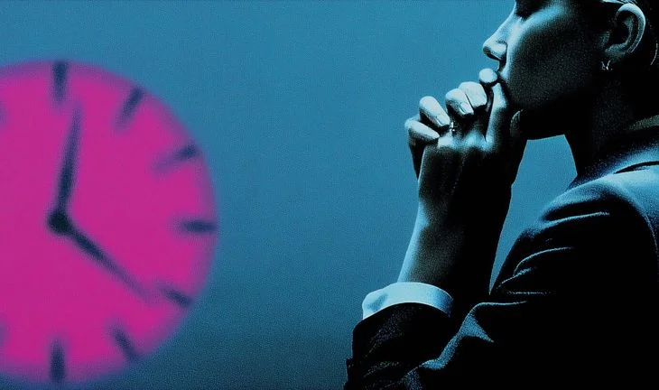 Banker biting her nails