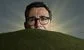 Andy Burnham behind a hill with sunrays